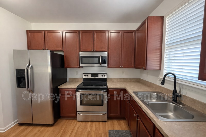 Spacious End-Unit Condo with Dual Primary Suites & Bonus Room  - Photo 3