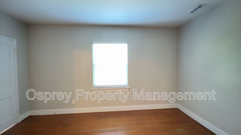 Charming 2BR with Sunroom, Hardwood Floors & Lawn Care Included - Photo 9