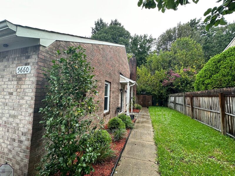 Welcome to this beautiful all-brick-end unit townhome 