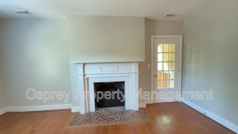 Charming 2BR with Sunroom, Hardwood Floors & Lawn Care Included - Photo 8
