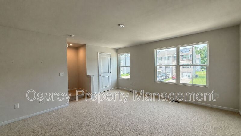 Charming 3-Bedroom Suffolk Home with Garage & Deck - Photo 6