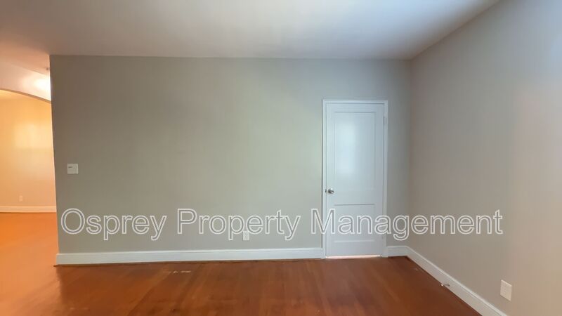 Charming 2BR with Sunroom, Hardwood Floors & Lawn Care Included - Photo 10